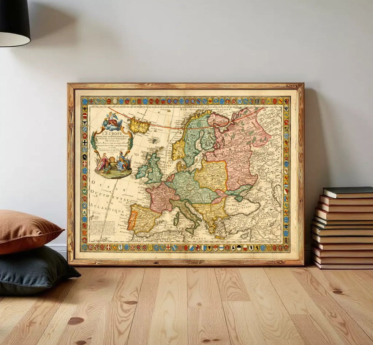 The image is a framed antique map of Europe, featuring detailed cartography and colorful borders.
