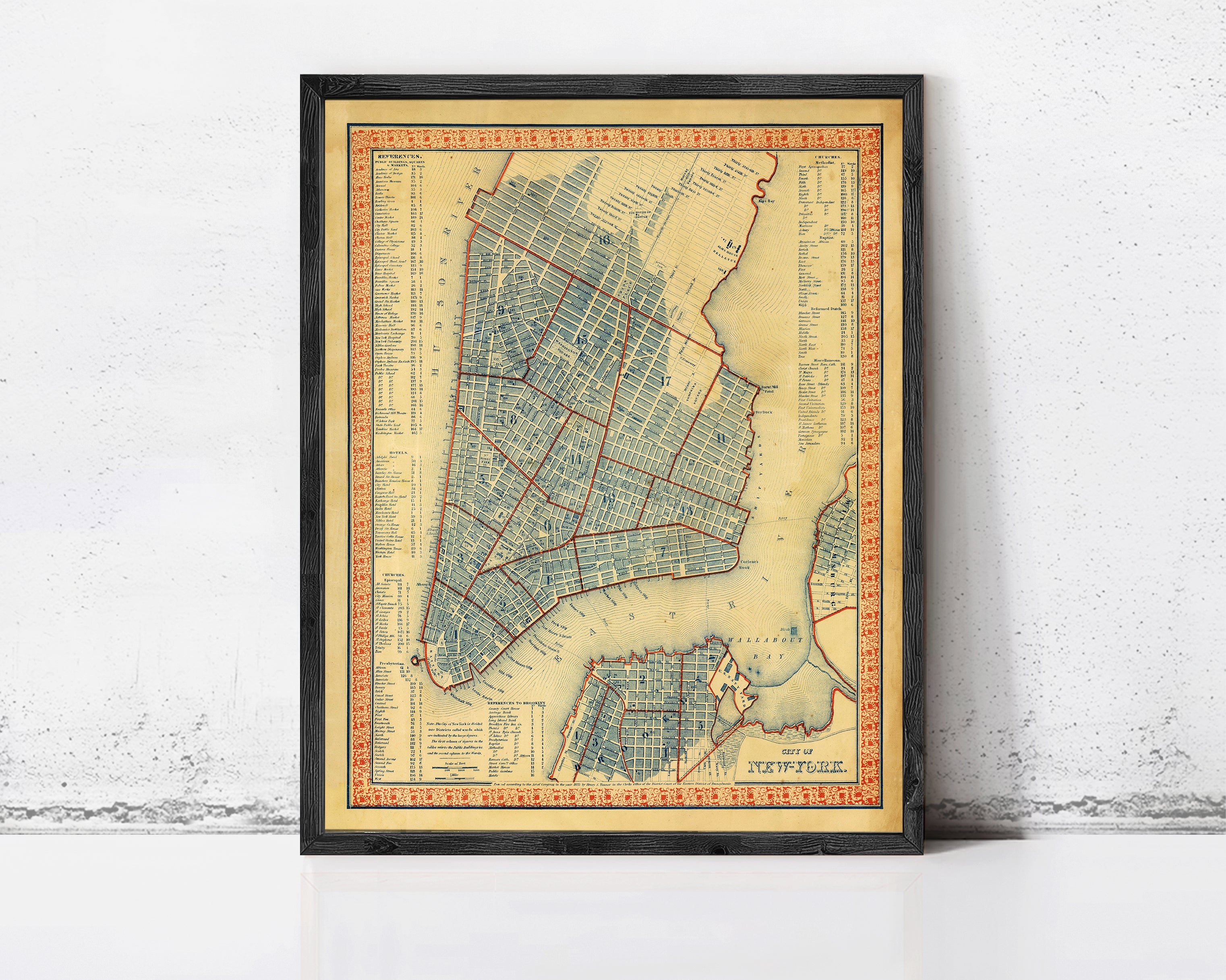 The image is a framed map of New York City, depicting the city's streets and neighborhoods in a detailed and colorful manner.