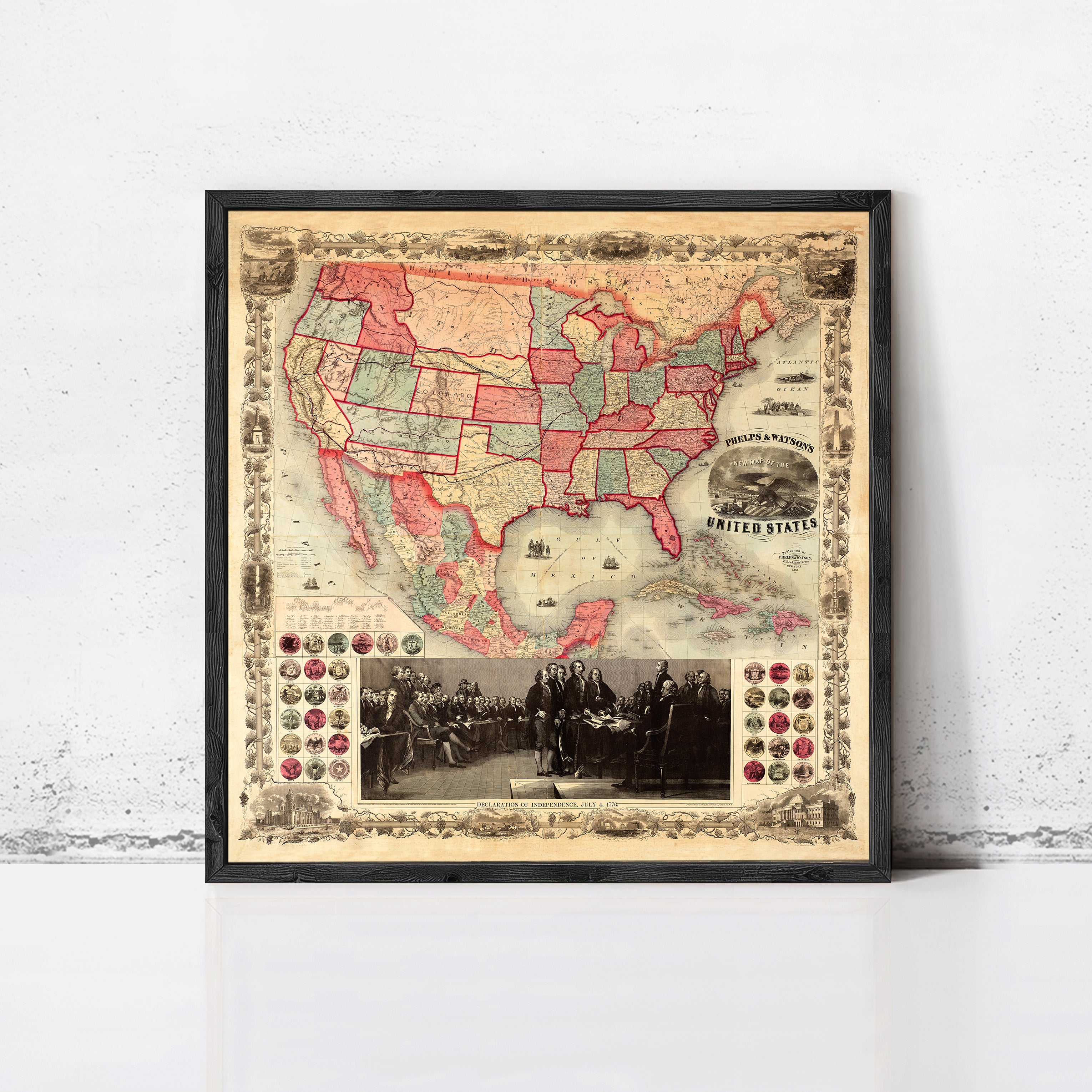 The image is a framed vintage map of the United States, with a black and white photograph of a group of people in the bottom right corner.