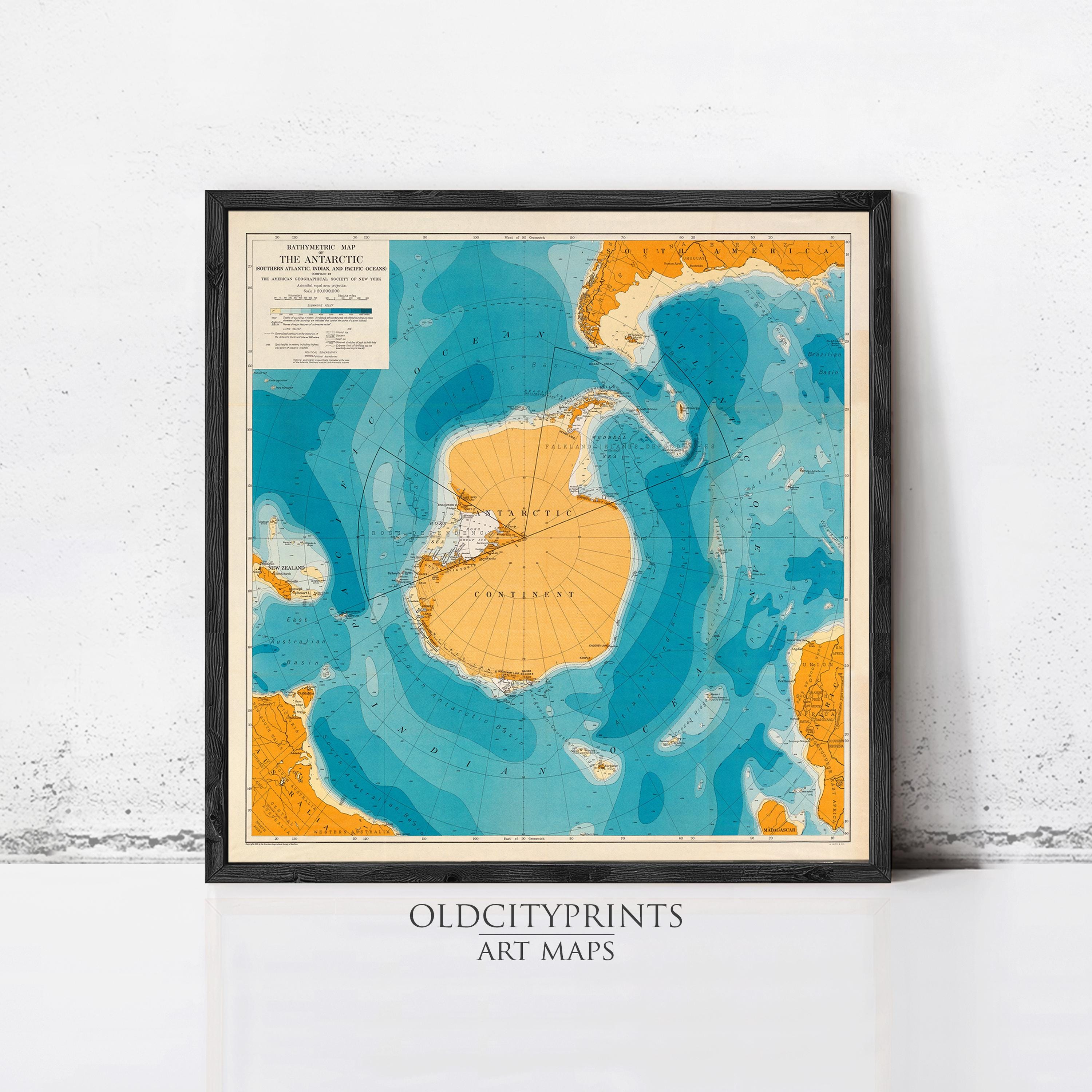 The image is a framed vintage map of the Antarctic continent, depicting the surrounding waters and landmasses in a stylized manner.