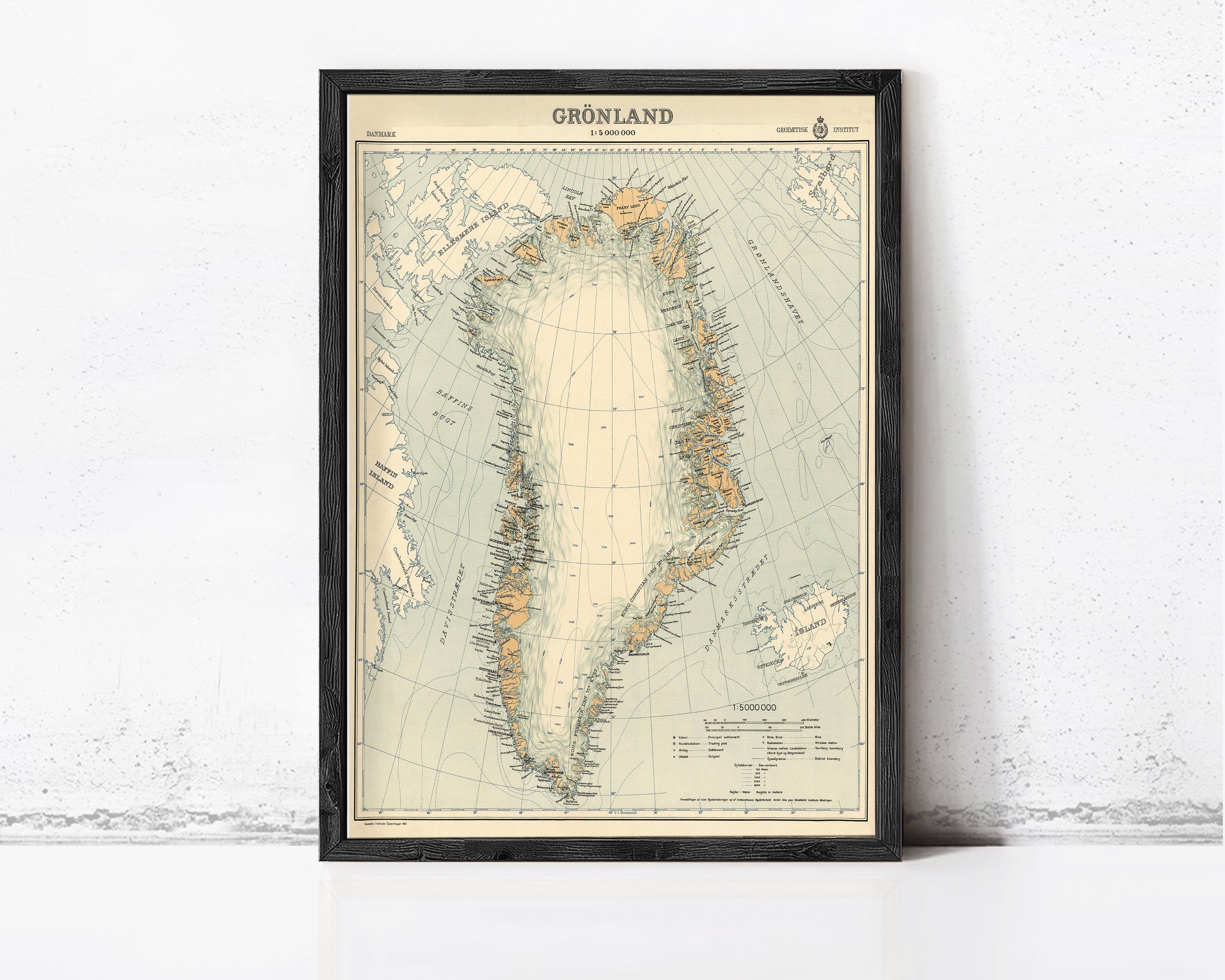 The image is a framed map of Greenland, depicting the country and surrounding areas in a vintage style.