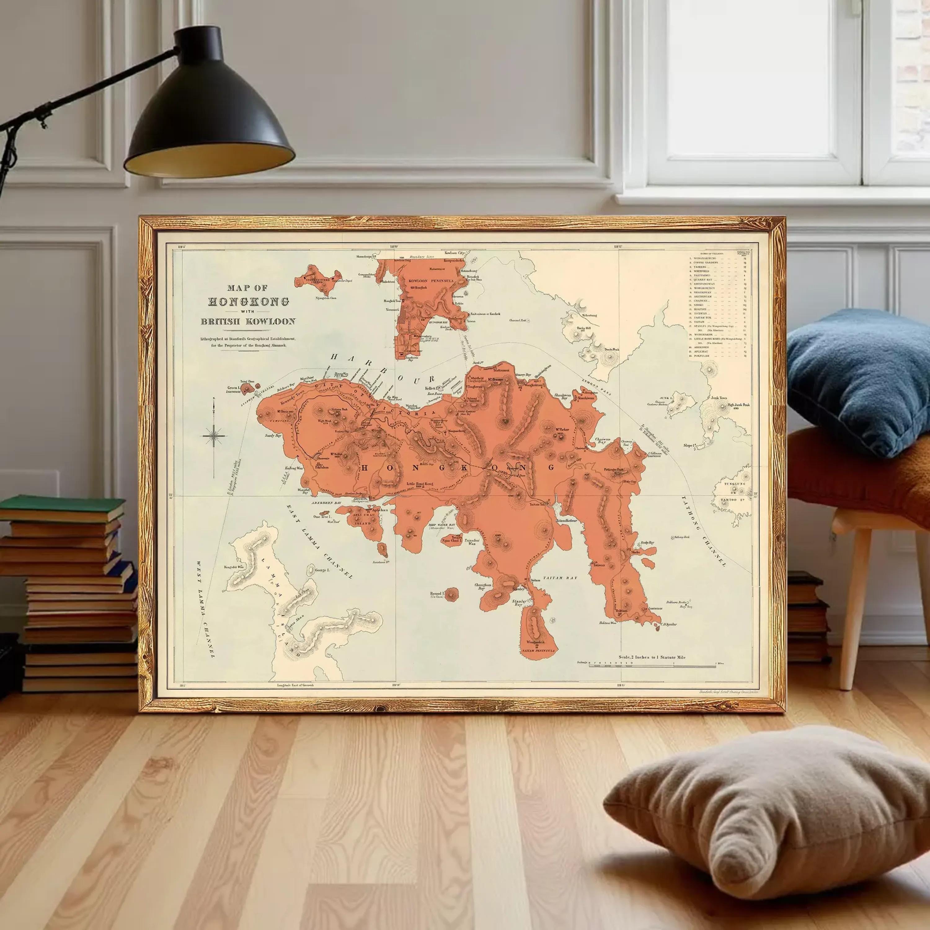 The image is a framed vintage map of Hong Kong, depicting the island and surrounding areas in a detailed and colorful manner.