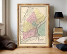 The image is a framed vintage map of the city of Toledo, Ohio, depicting the city's streets and neighborhoods in a detailed and colorful manner.