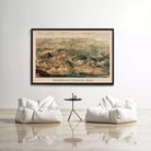 a large framed map of Yellowstone National Park hanging on a white wall, with two white bean bag chairs positioned in front of it.