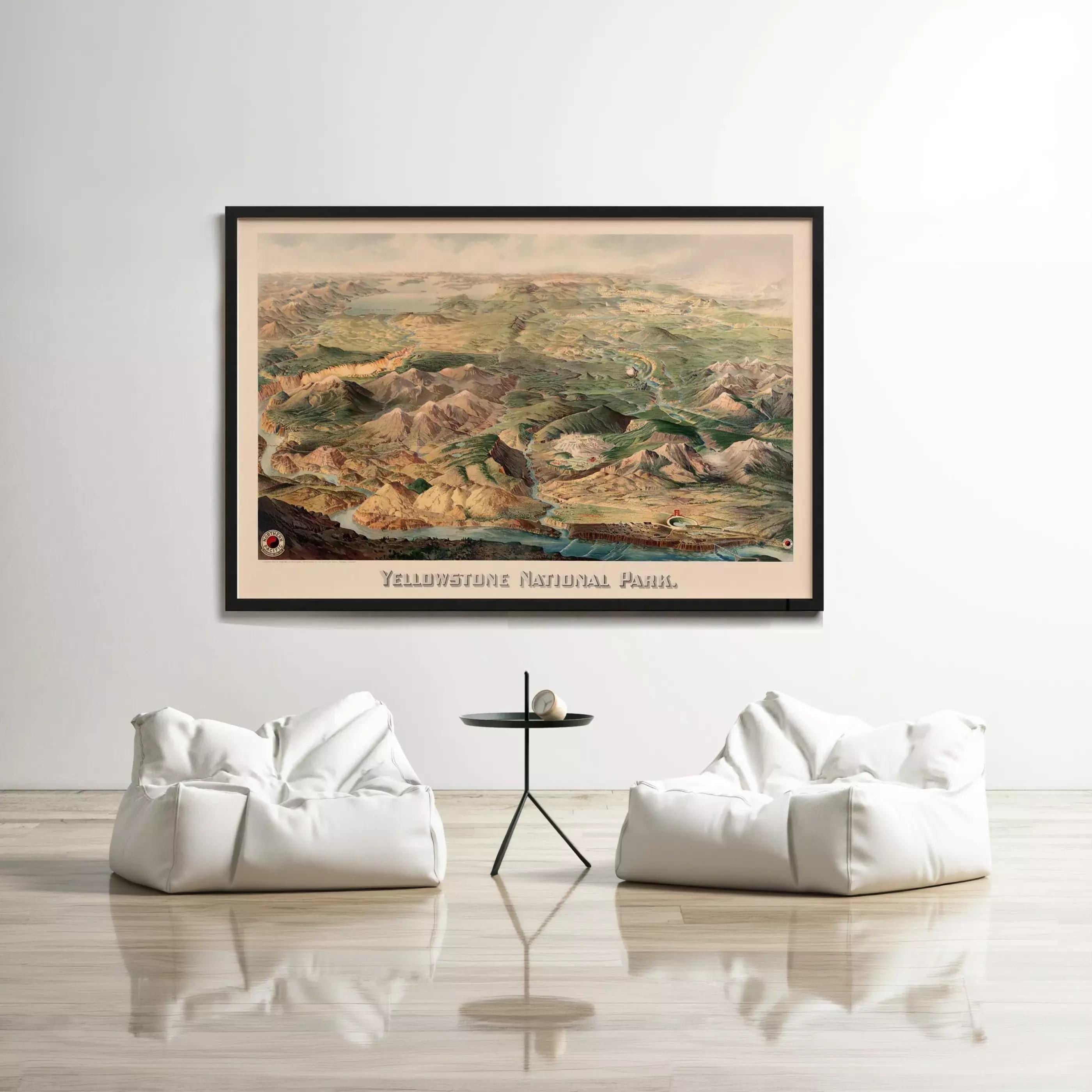 a large framed map of Yellowstone National Park hanging on a white wall, with two white bean bag chairs positioned in front of it.