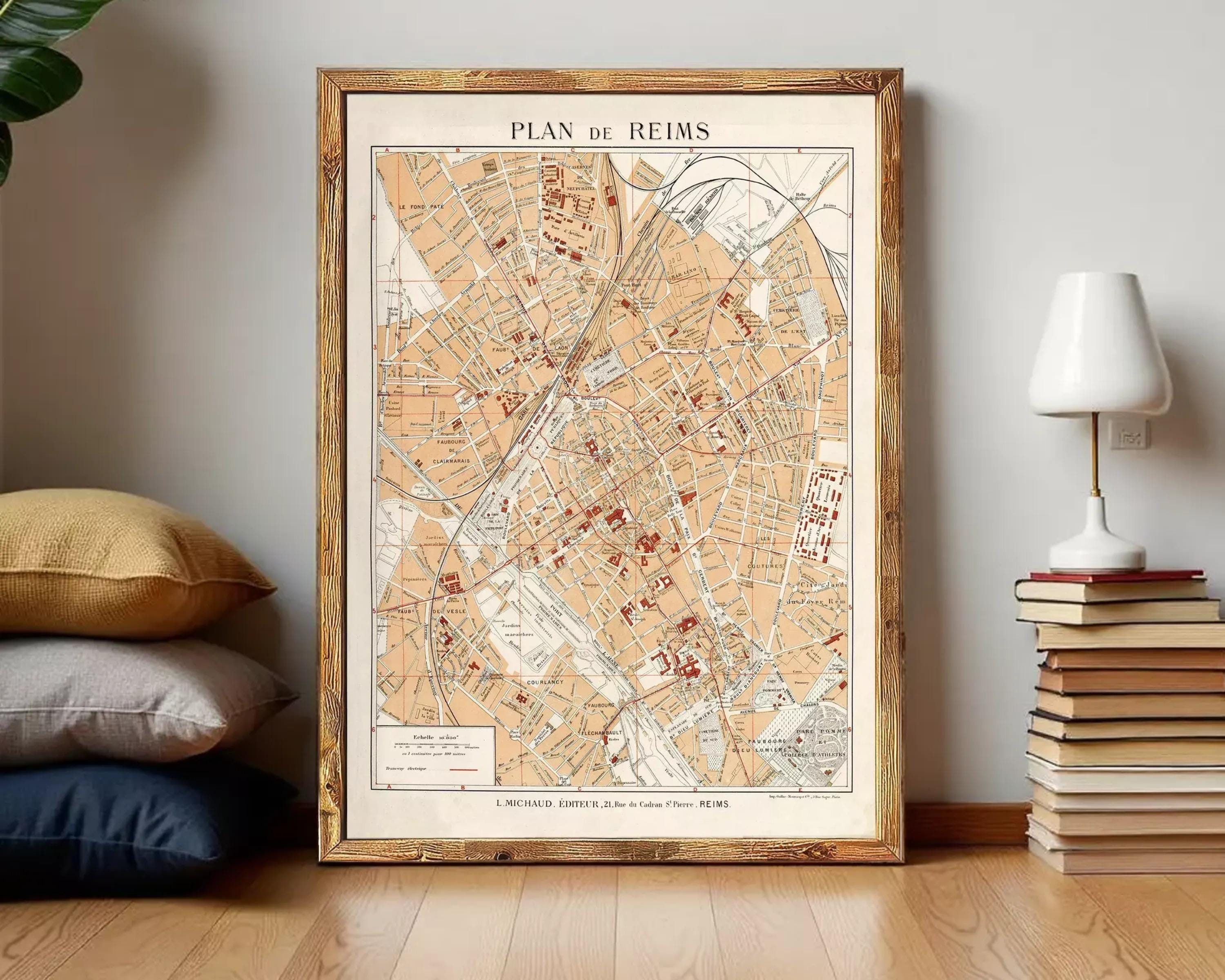 The image is a framed map of Reims, France, depicting the city's streets and landmarks.