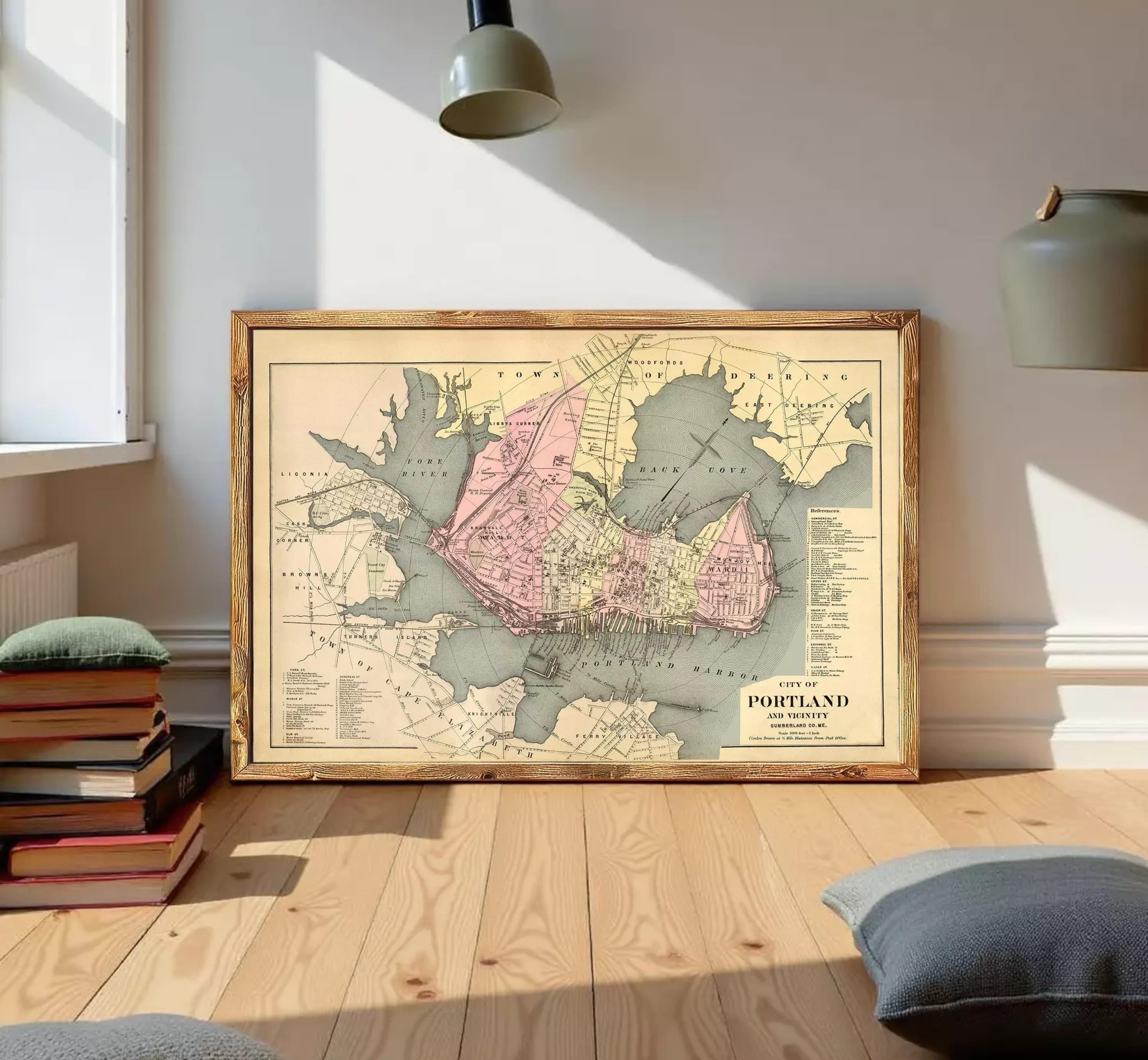 The image is a framed vintage map of Portland, Oregon, depicting the city and surrounding areas.