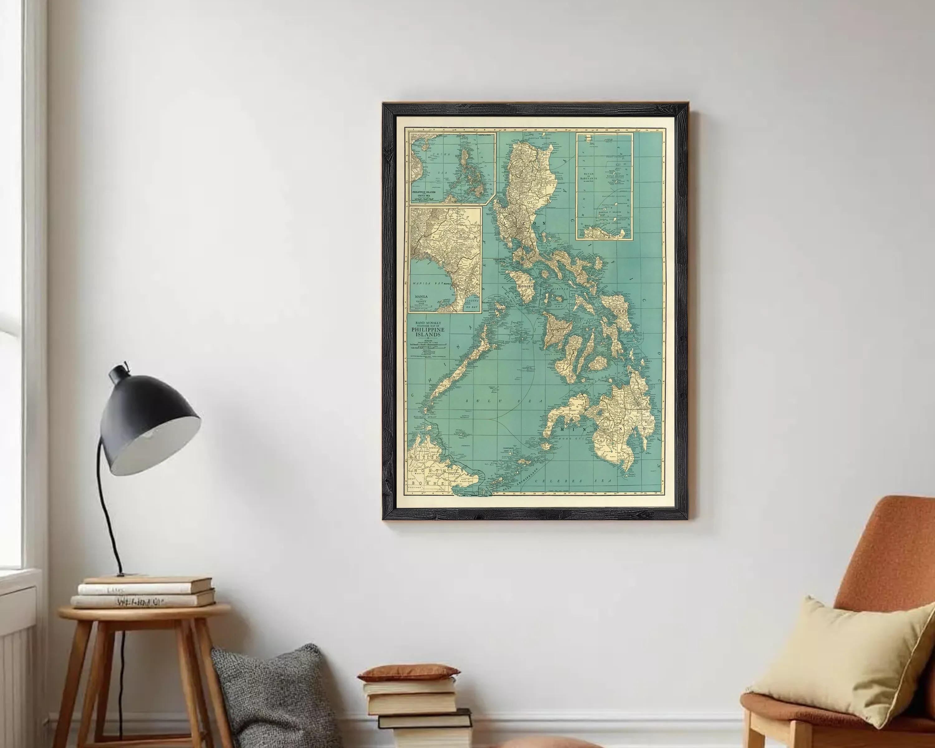 The image is a framed vintage map of the Philippines, showing the country's geographical layout and surrounding areas.