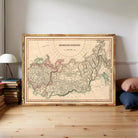 a large framed map of the Russian Empire, with a wooden frame and a vintage style.