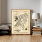 The image is a framed map of the Netherlands, depicting various landmarks and geographical features.