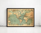 The image is a framed vintage map of the world, depicting the continents and oceans in a detailed and intricate manner.