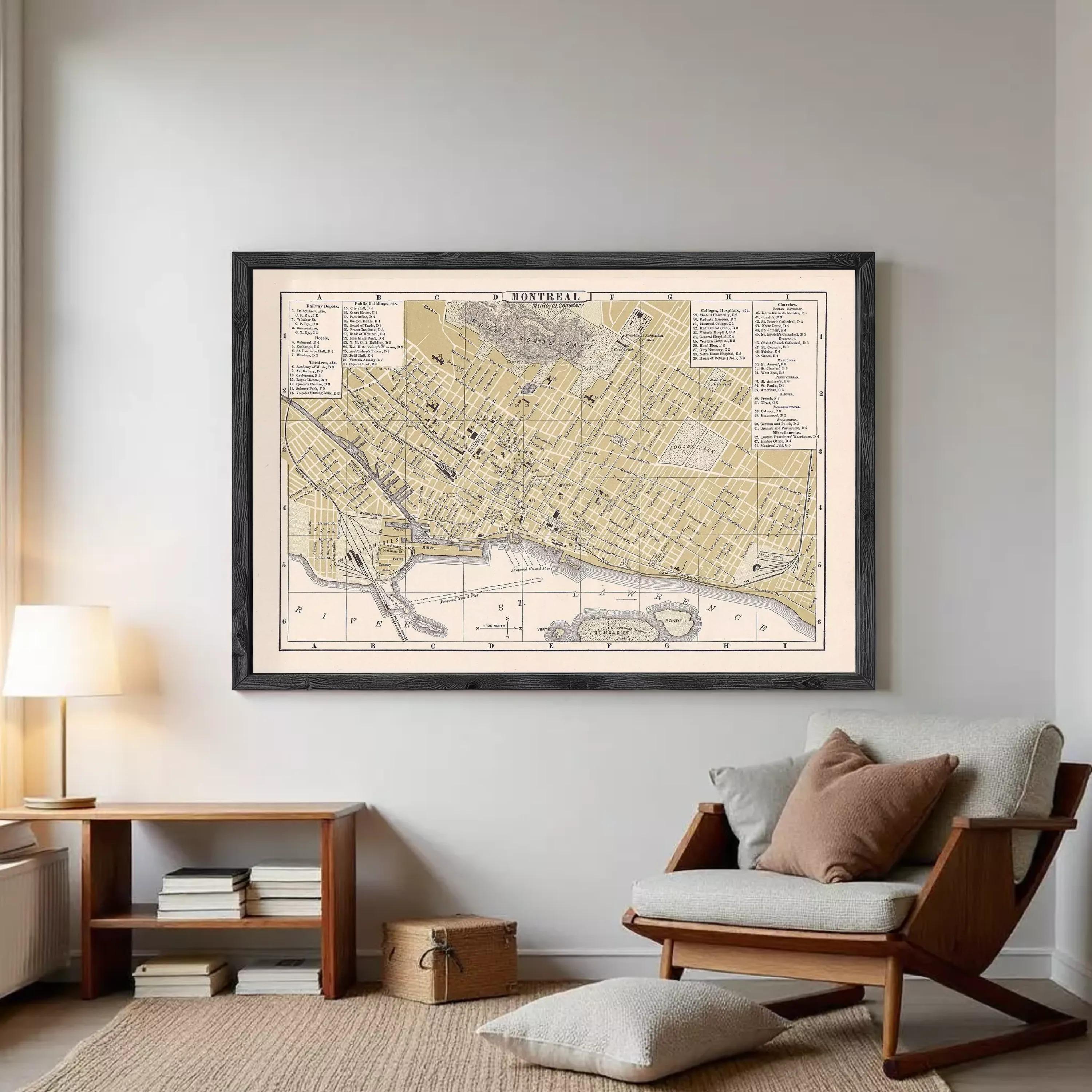 The image is a framed vintage map of a city, likely from the 19th century, displayed on a wall.