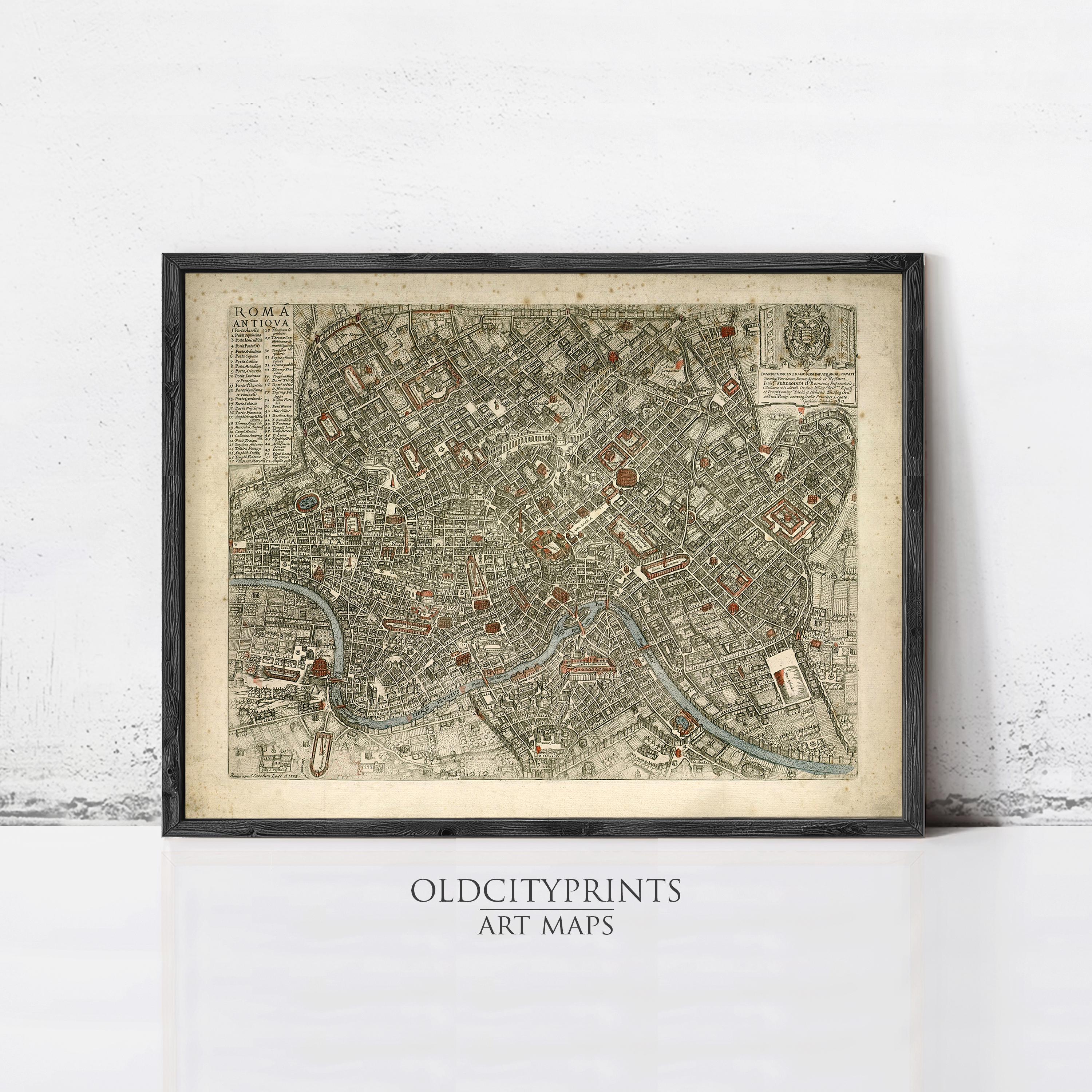 The image is a framed vintage map of a city, likely Rome, with intricate details and a historical appearance.