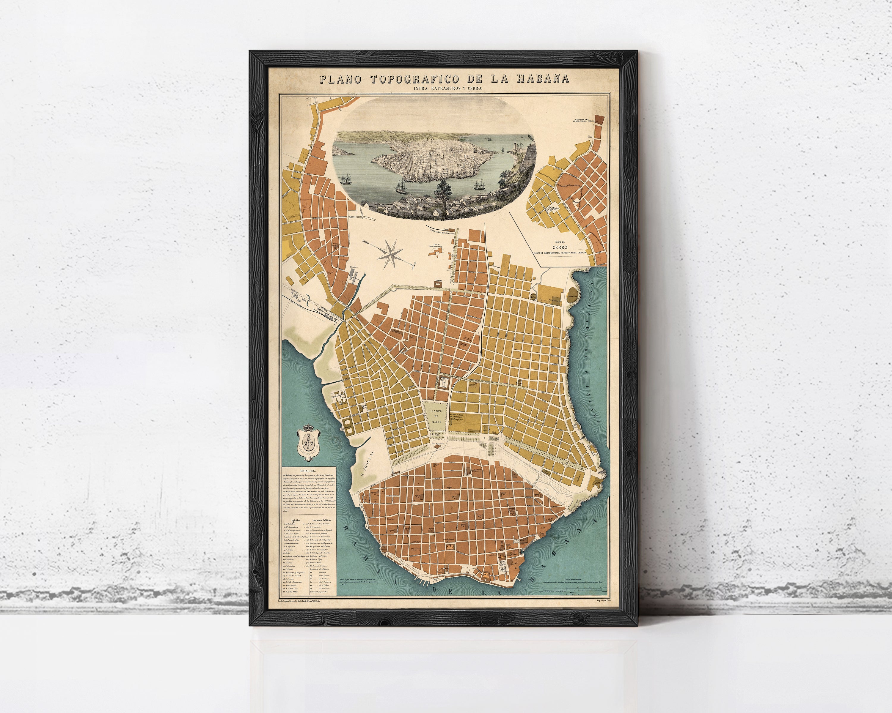 The image is a framed vintage map of a city, likely Havana, Cuba, with a detailed illustration of the city's layout and surrounding areas.