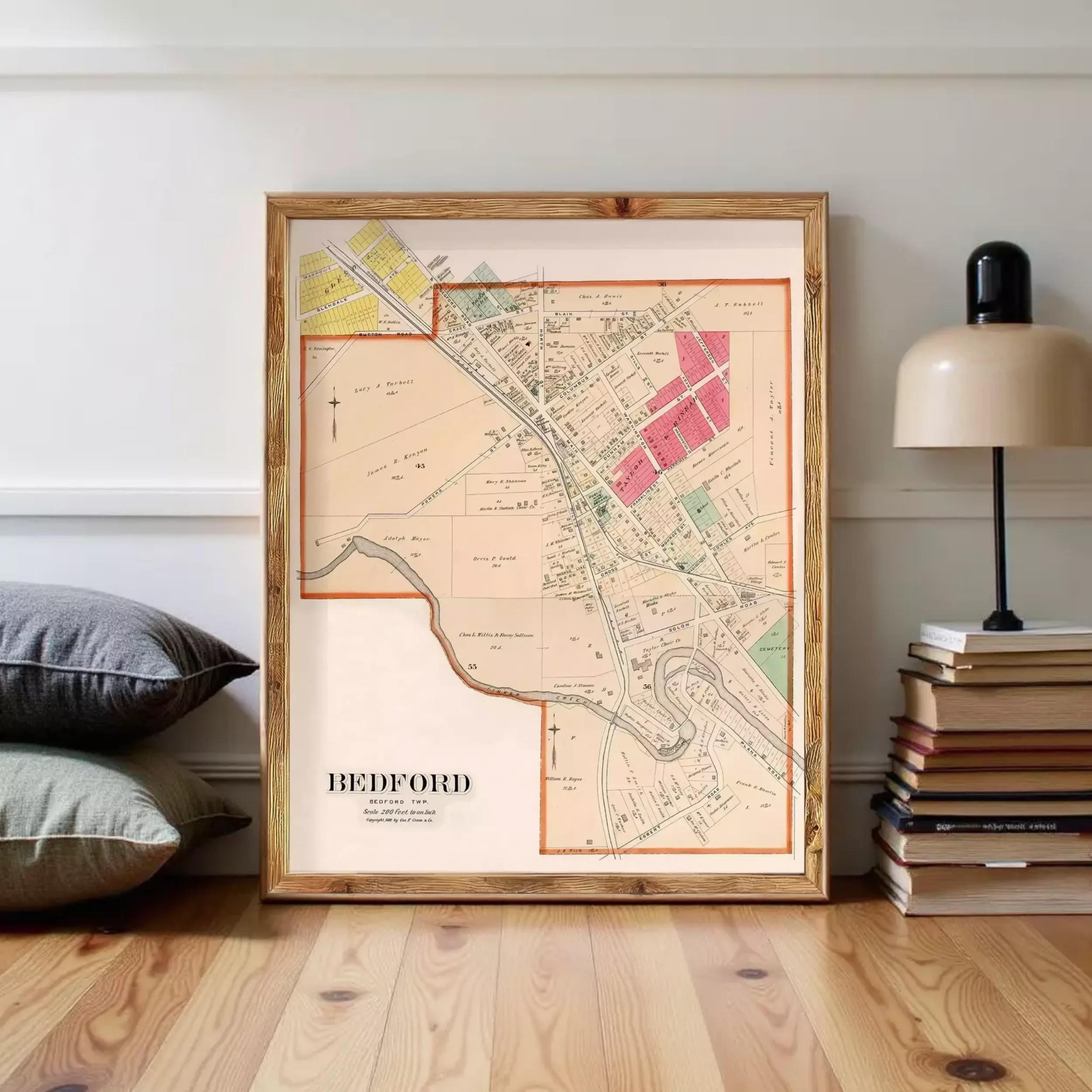 A framed map of Bedford, New Jersey, with various colored areas and streets labeled.