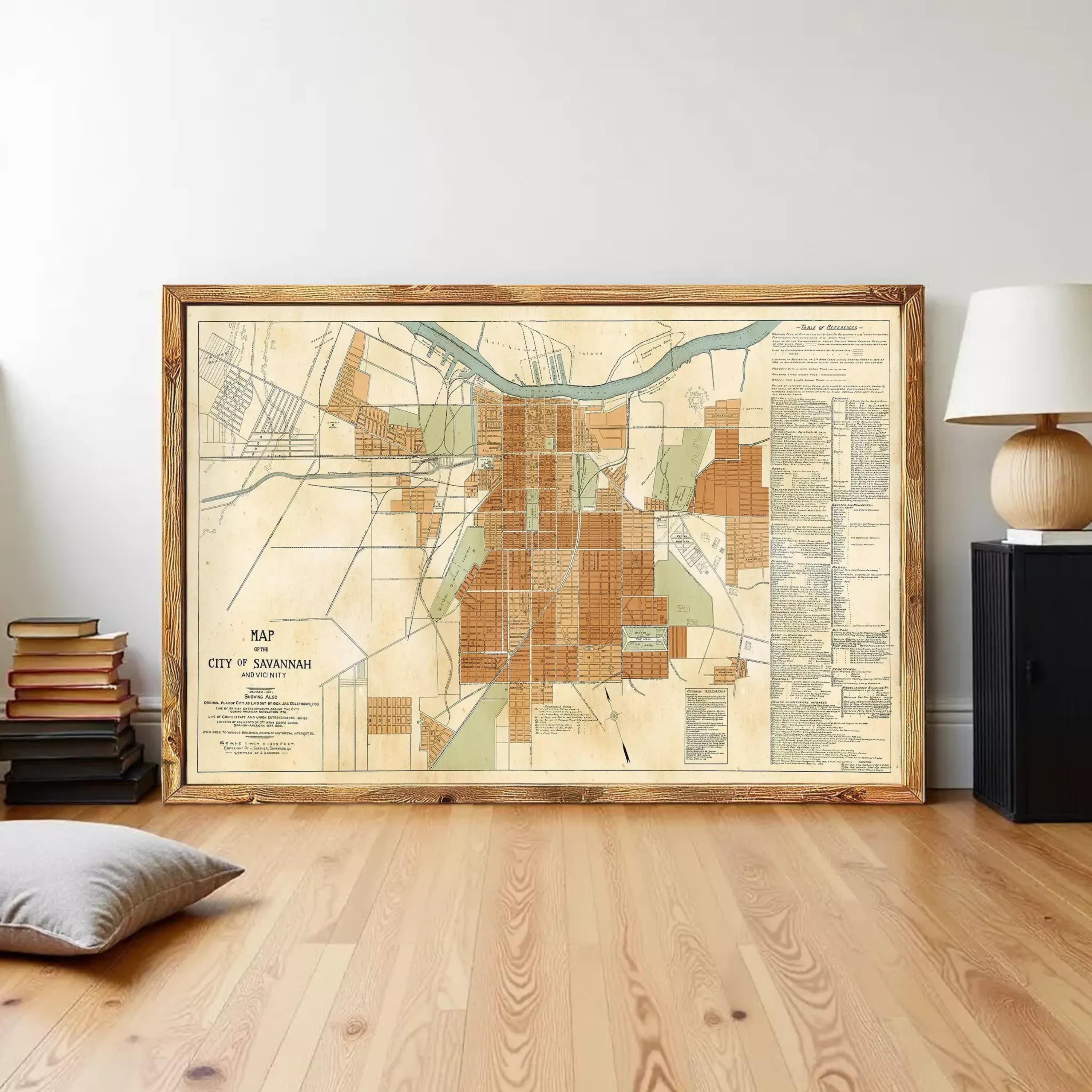 The image is a framed map of the city of Savannah, Georgia, showing the layout of the city and surrounding areas.
