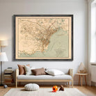 a large framed map of Singapore hanging on a wall in a living room.