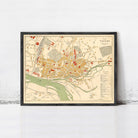 The image is a framed vintage map of a city, likely from the 19th century, depicting the layout and streets of the area.