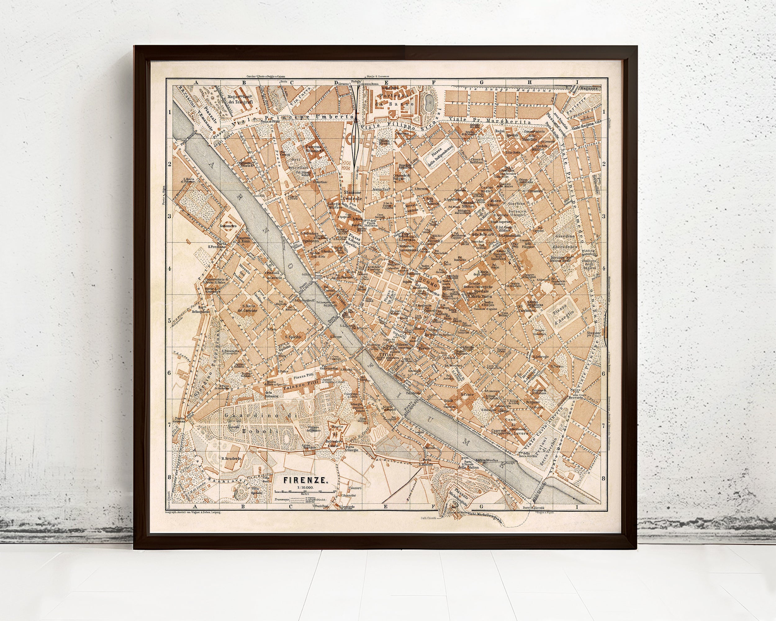 The image is a framed vintage map of Florence, Italy, depicting the city's streets, landmarks, and surrounding areas.