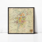 The image is a framed vintage map of a city, depicting various landmarks and geographical features.