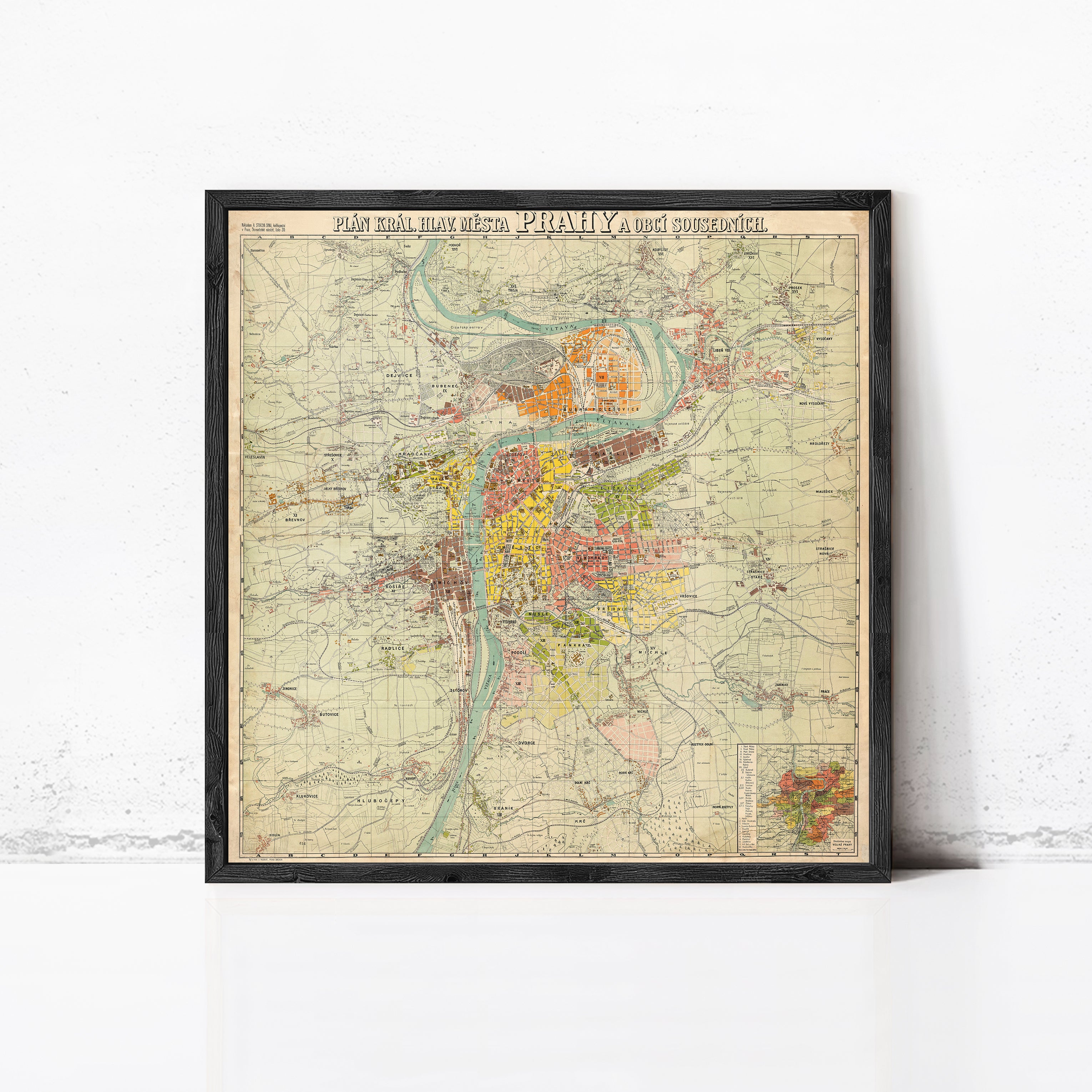 The image is a framed vintage map of a city, depicting various landmarks and geographical features.