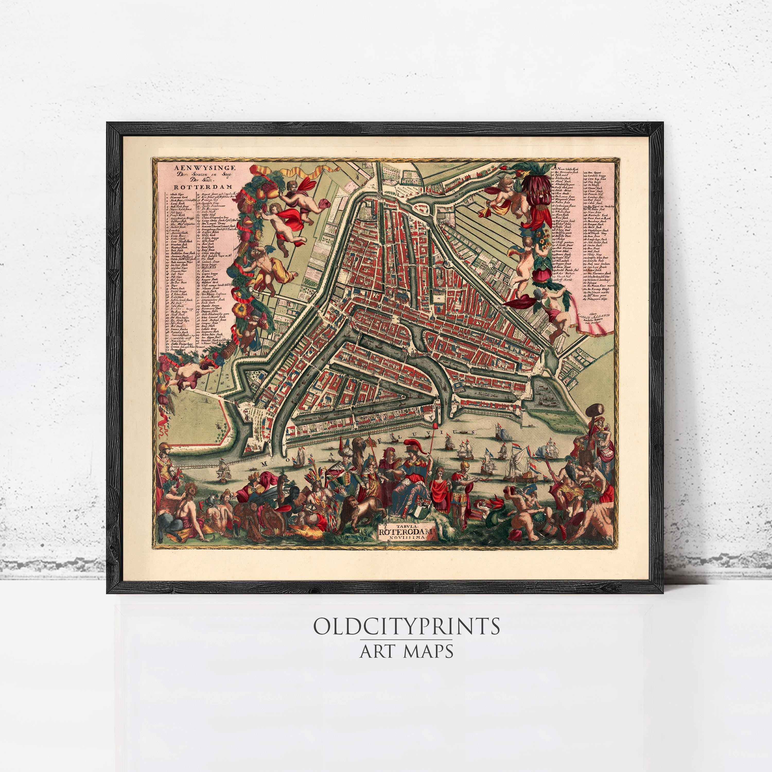 The image is a framed vintage map of Amsterdam, Netherlands, depicting a detailed and colorful cityscape with various landmarks and streets.