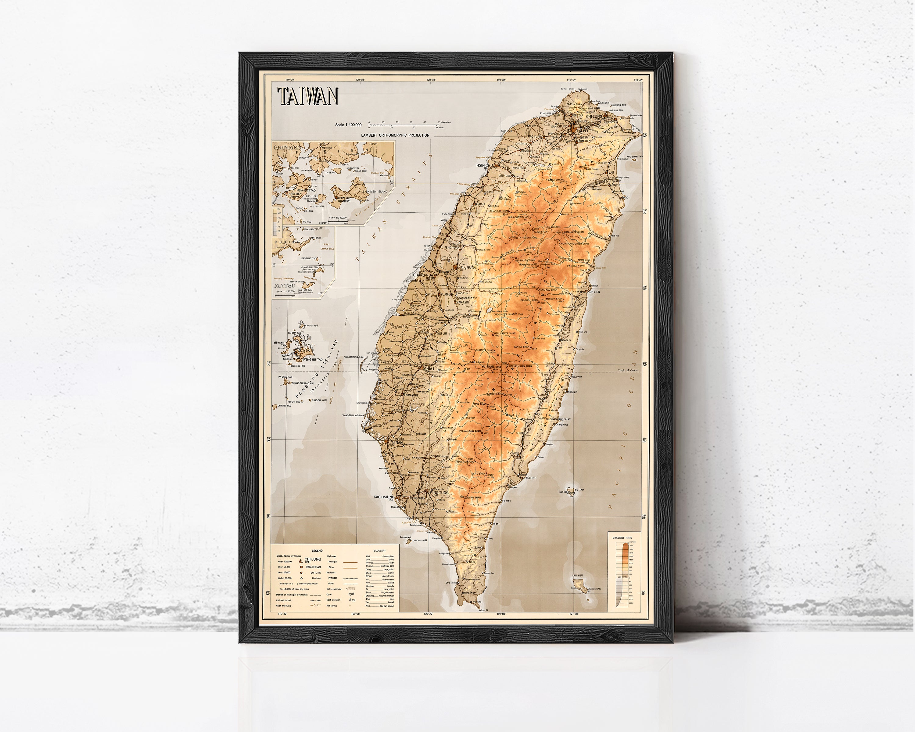 The image is a framed map of Taiwan, depicting the country's geographical layout and surrounding areas.