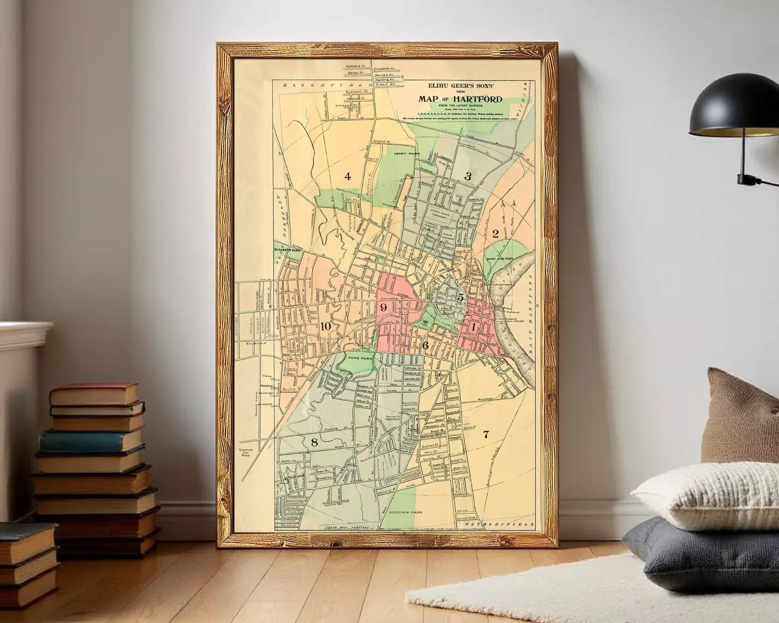 The image is a framed vintage map of the town of Hartford, Connecticut, showing the layout of the streets, neighborhoods, and other geographical features.