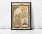 The image is a framed antique map of New England, depicting the region in a vintage style with intricate details and decorative elements.