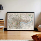 A framed map of Shanghai, China, with a river and various streets visible.