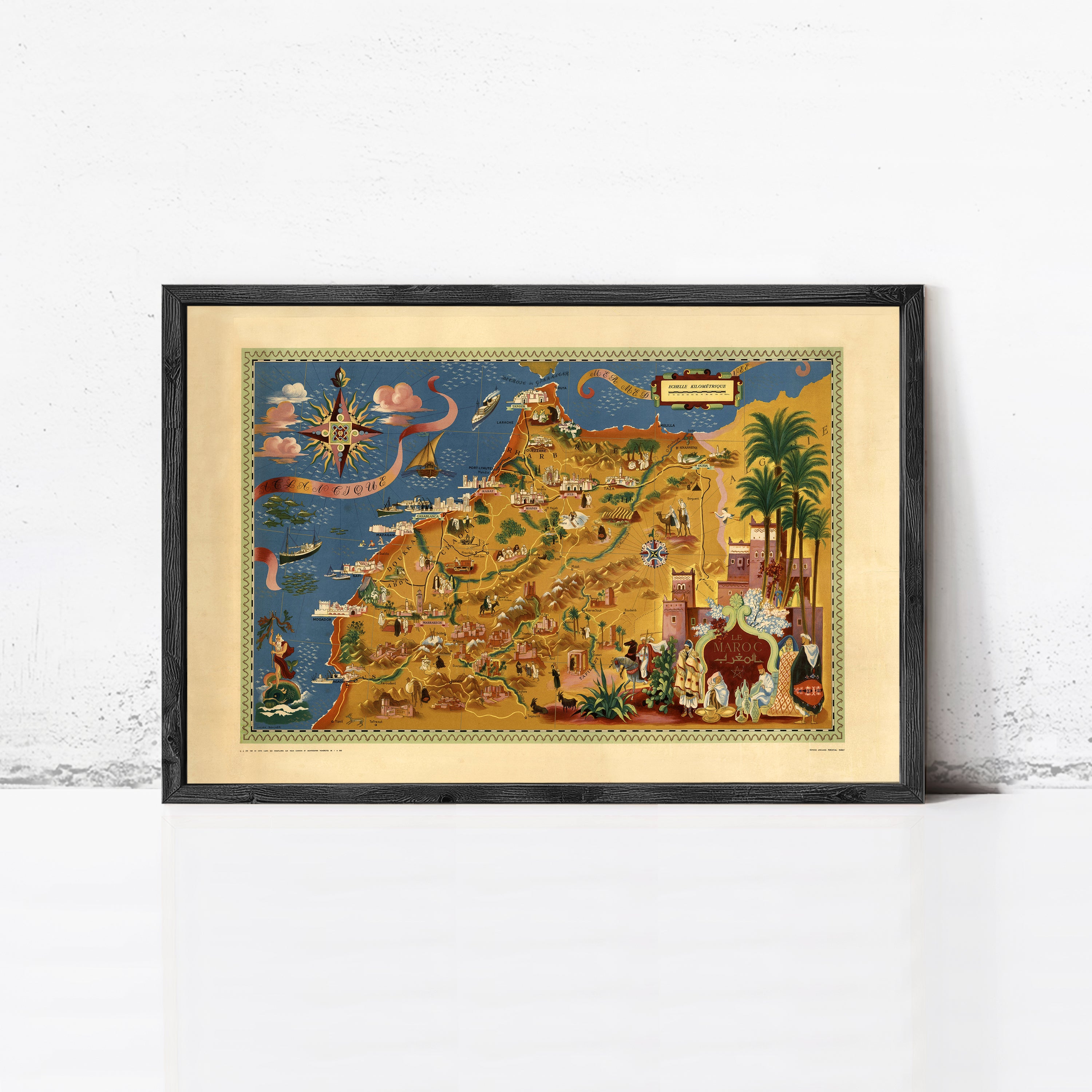 The image is a framed illustration depicting a colorful and detailed map of a region, with various landmarks and elements such as palm trees, buildings, and people.