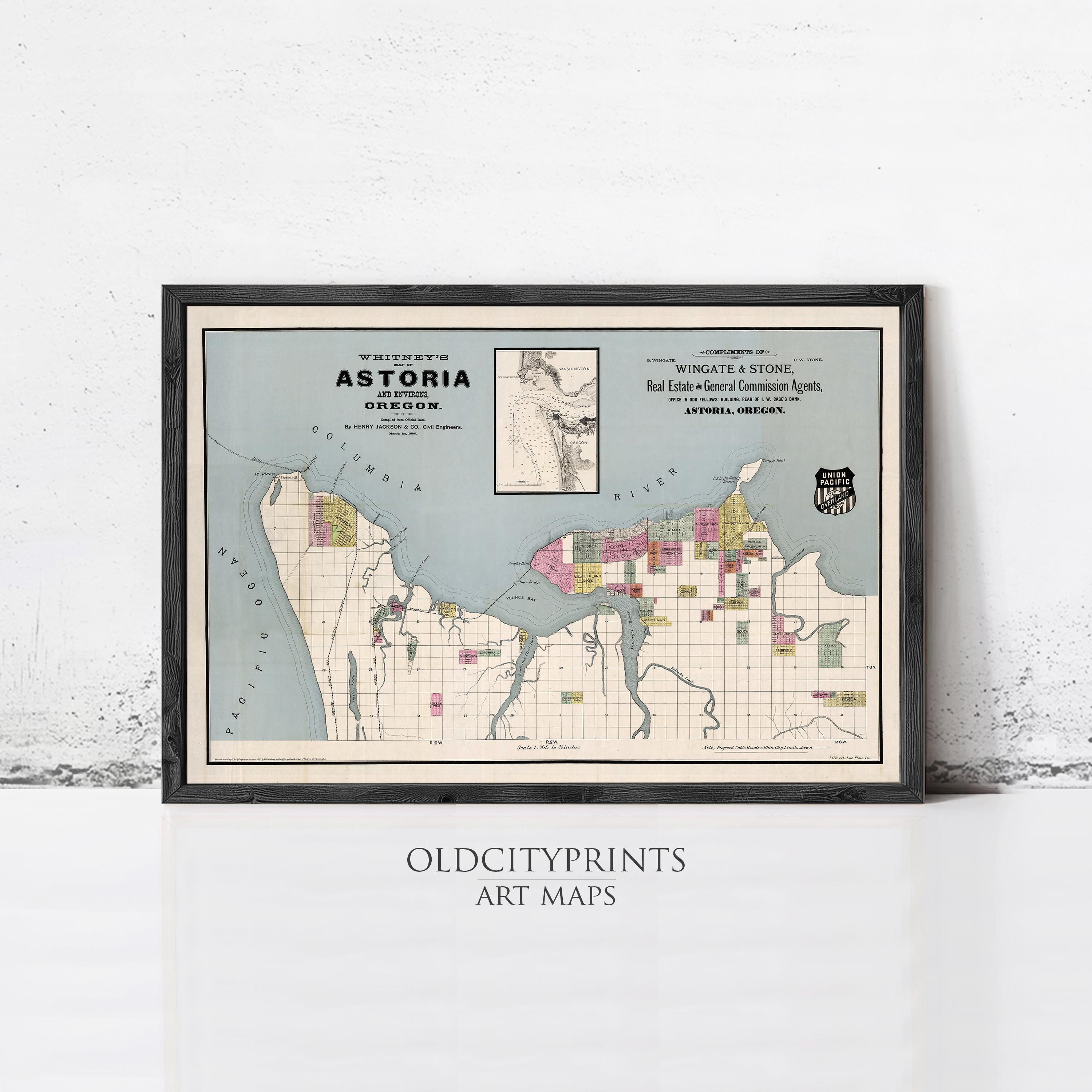 The image is a framed vintage map of Astoria, Oregon, depicting the area in a detailed and colorful manner.