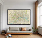 The image is a framed vintage map of London, depicting the city's streets, landmarks, and rivers.