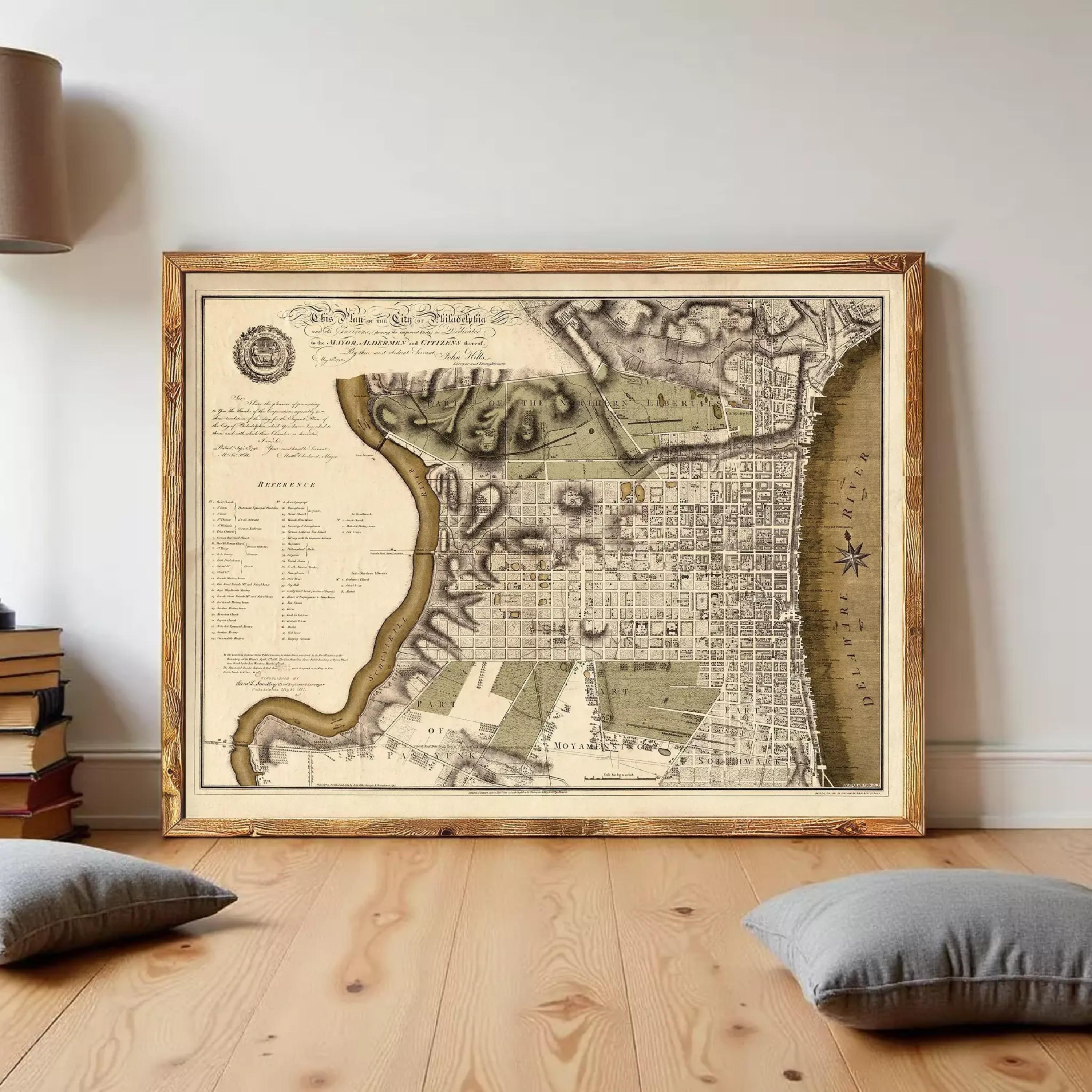 The image is a framed antique map of Philadelphia, Pennsylvania, depicting the city's layout and surrounding areas.