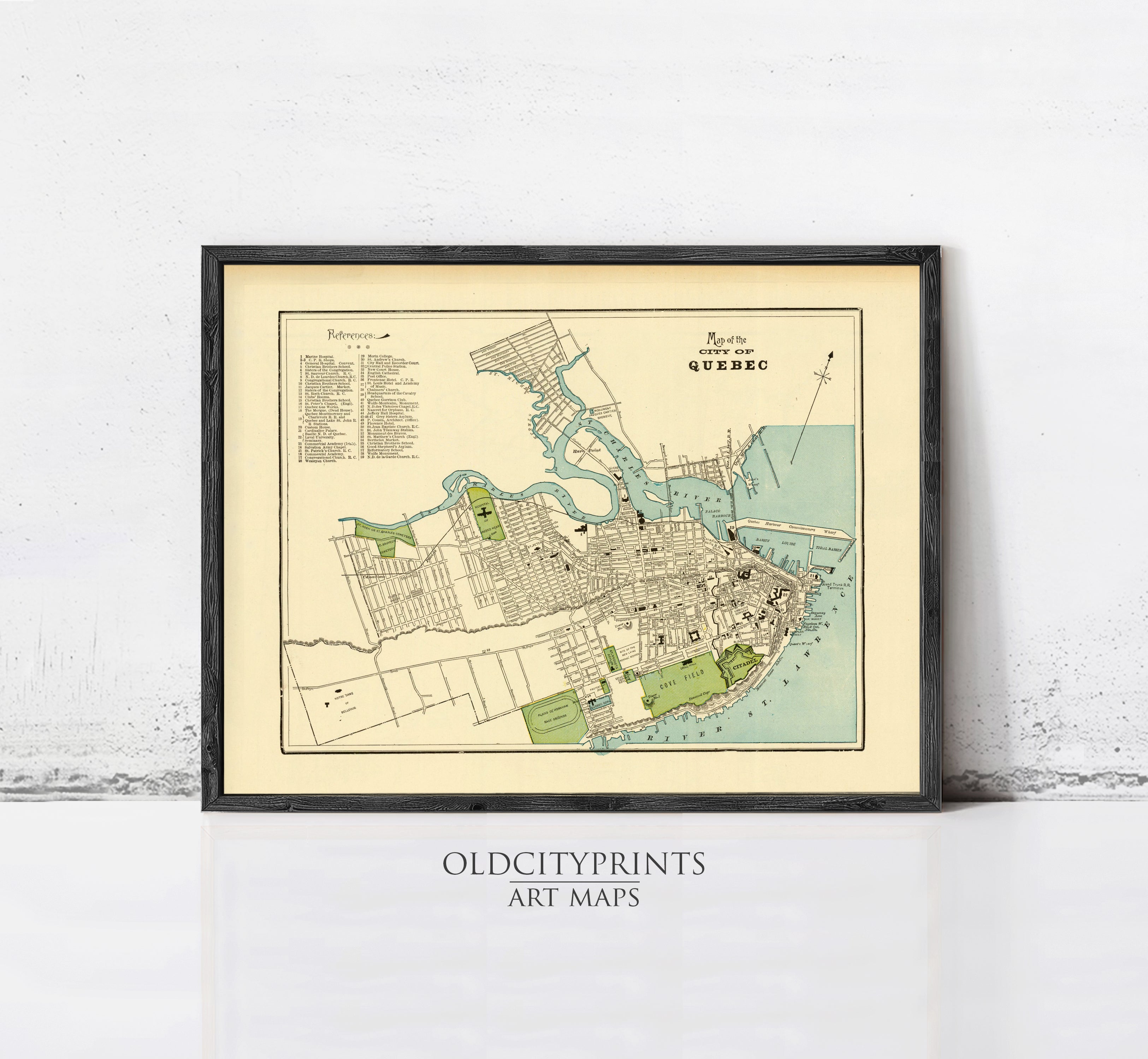 The image is a framed vintage map of Quebec, Canada, depicting the city's layout and surrounding areas.