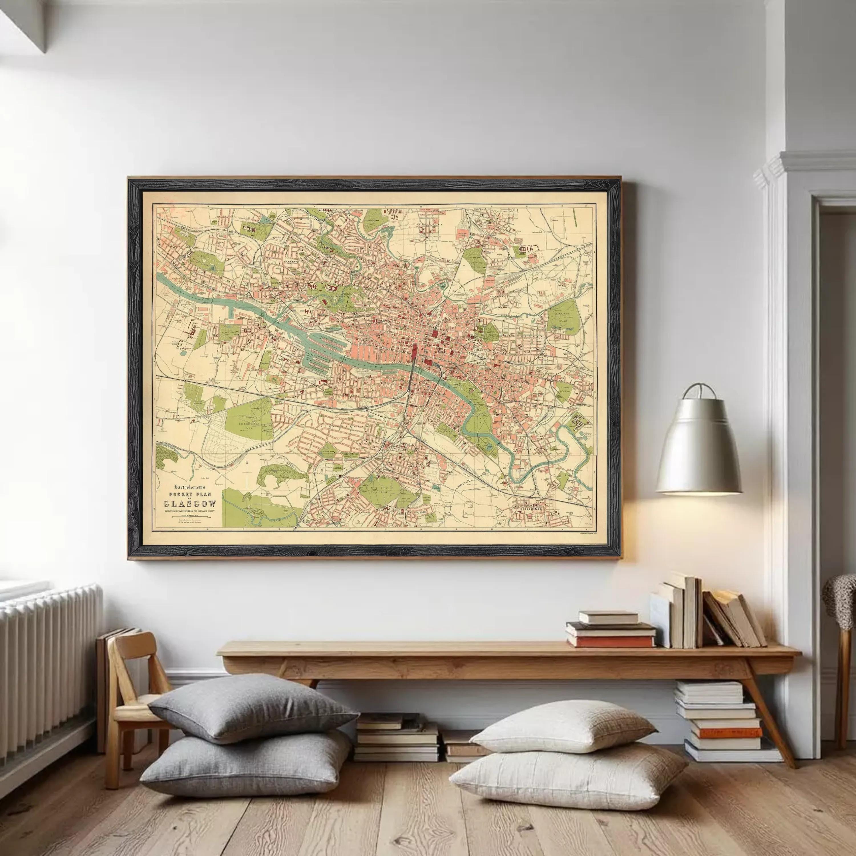 The image is a framed vintage map of a city, likely London, with various streets, landmarks, and neighborhoods depicted in a detailed and colorful manner.