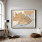 The image is a framed map of Quebec, Canada, depicting the city's streets, rivers, and surrounding areas.