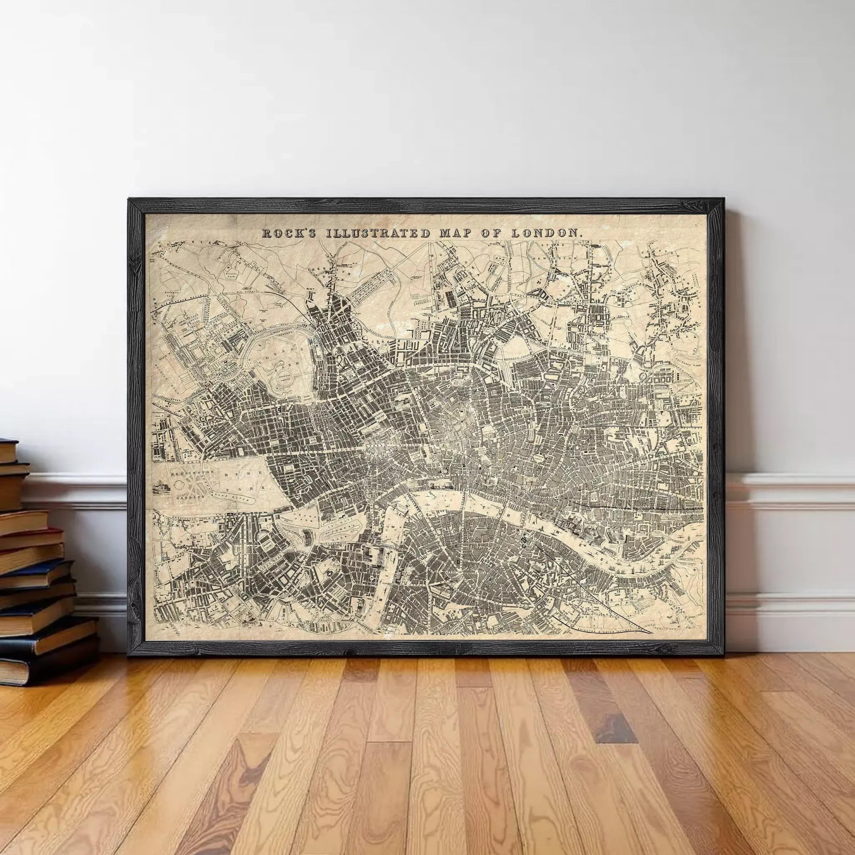 A framed illustration of a map of London, depicting the city's streets and landmarks.