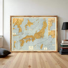 The image is a framed vintage map of Japan, depicting the country's geographical layout and surrounding areas.