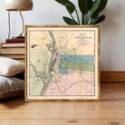 The image is a framed vintage map of Manchester, New Hampshire, showing the layout of the city and surrounding areas.