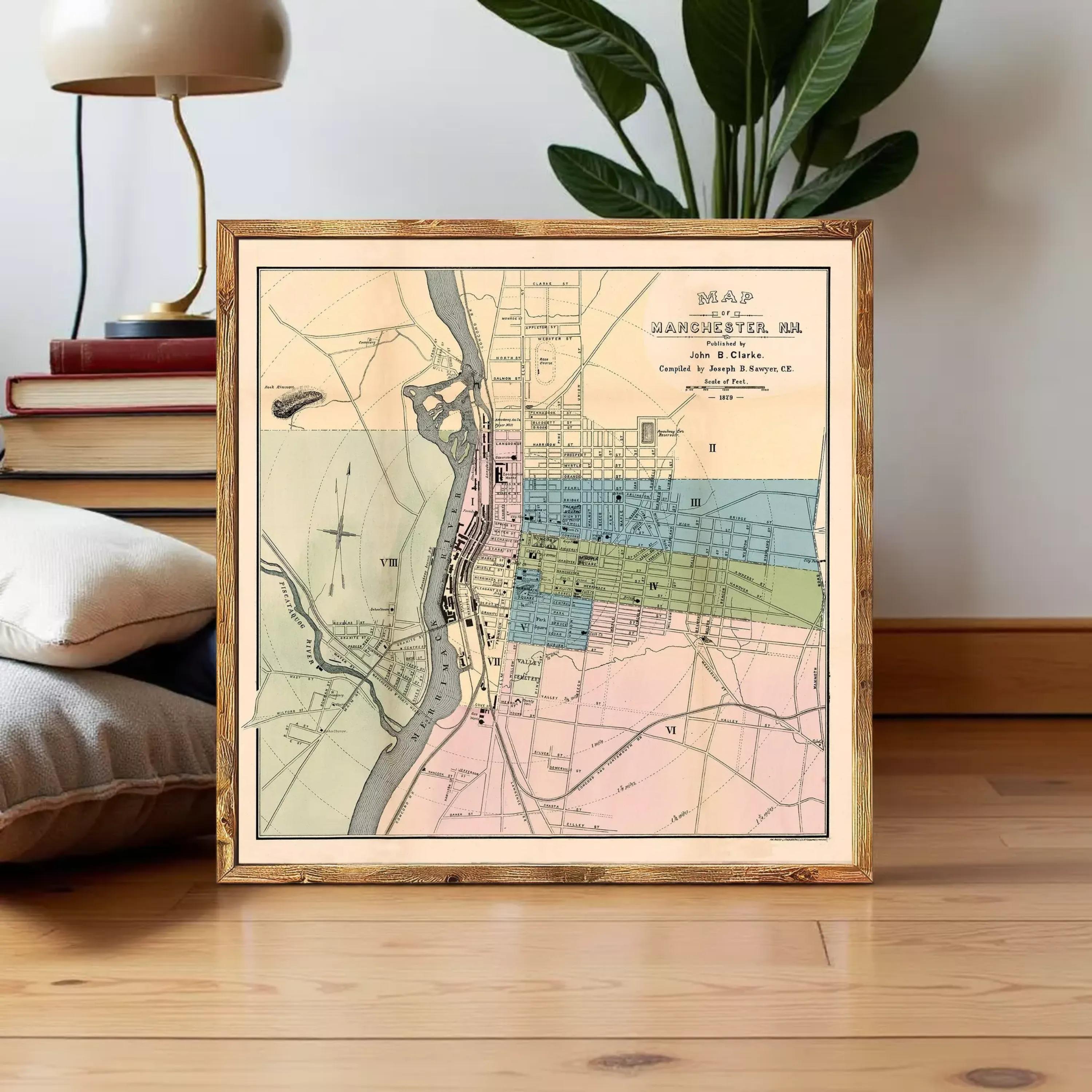 The image is a framed vintage map of Manchester, New Hampshire, showing the layout of the city and surrounding areas.
