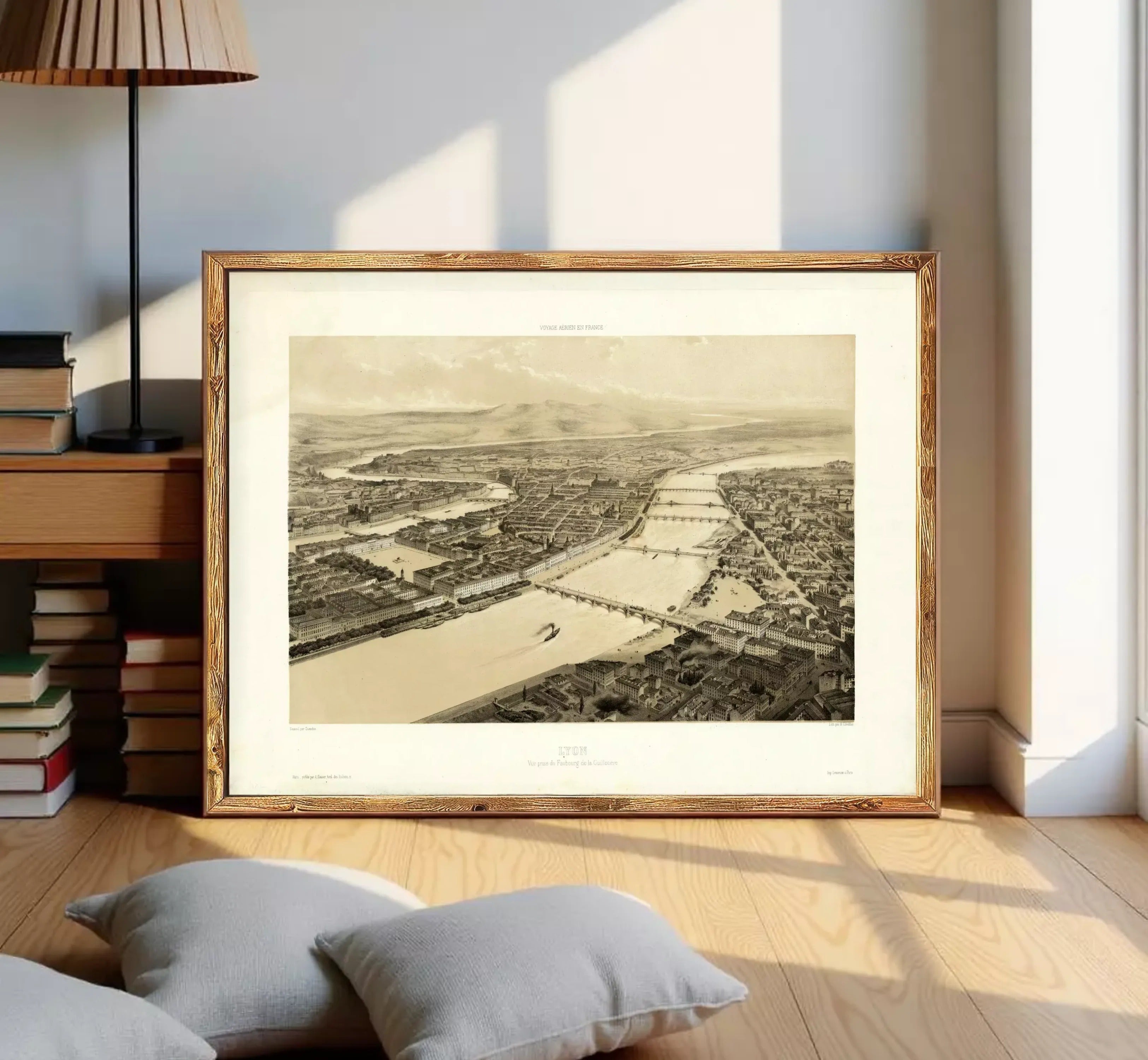The image is a framed black and white aerial photograph of a cityscape, depicting a river or canal running through the center of the city.