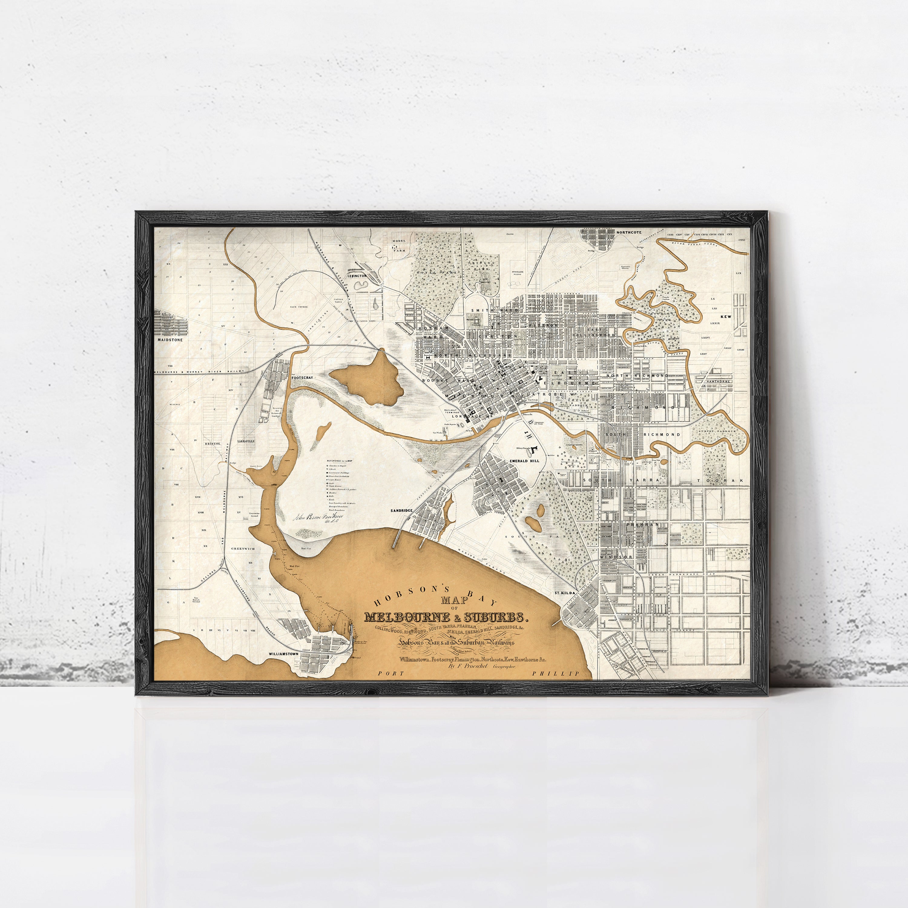The image is a framed vintage map of Melbourne, Australia, depicting the city's layout and surrounding areas.