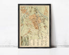 The image is a framed vintage map of a city, likely from the 19th century, with detailed geographical information and labels.