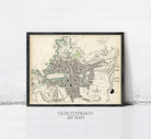 The image is a framed vintage map of a city, likely from the 19th century, with detailed cartography and markings.