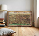 The image is a framed painting depicting a cityscape with a body of water in the foreground.