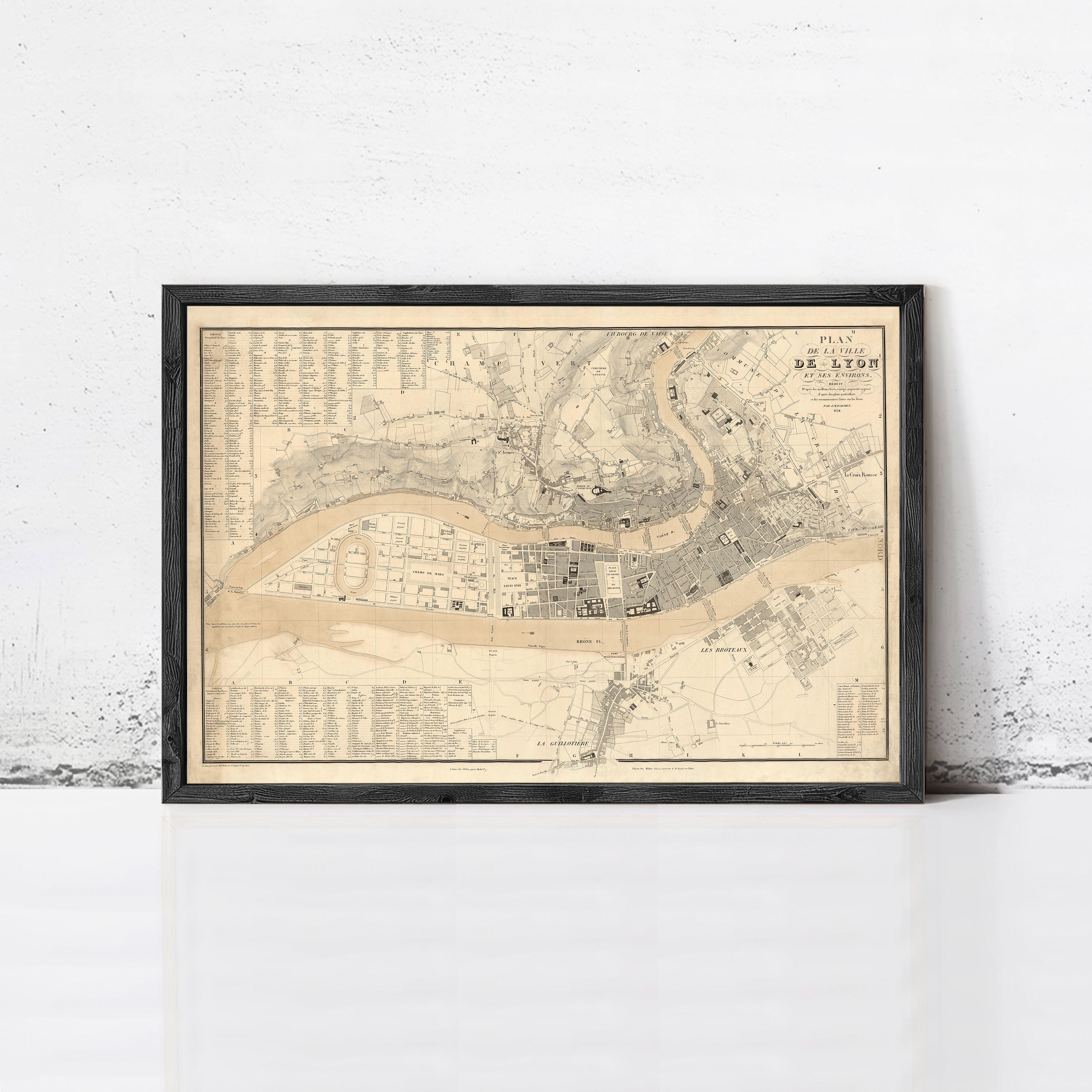 The image is a framed map of a city, likely London, with detailed street names and landmarks.