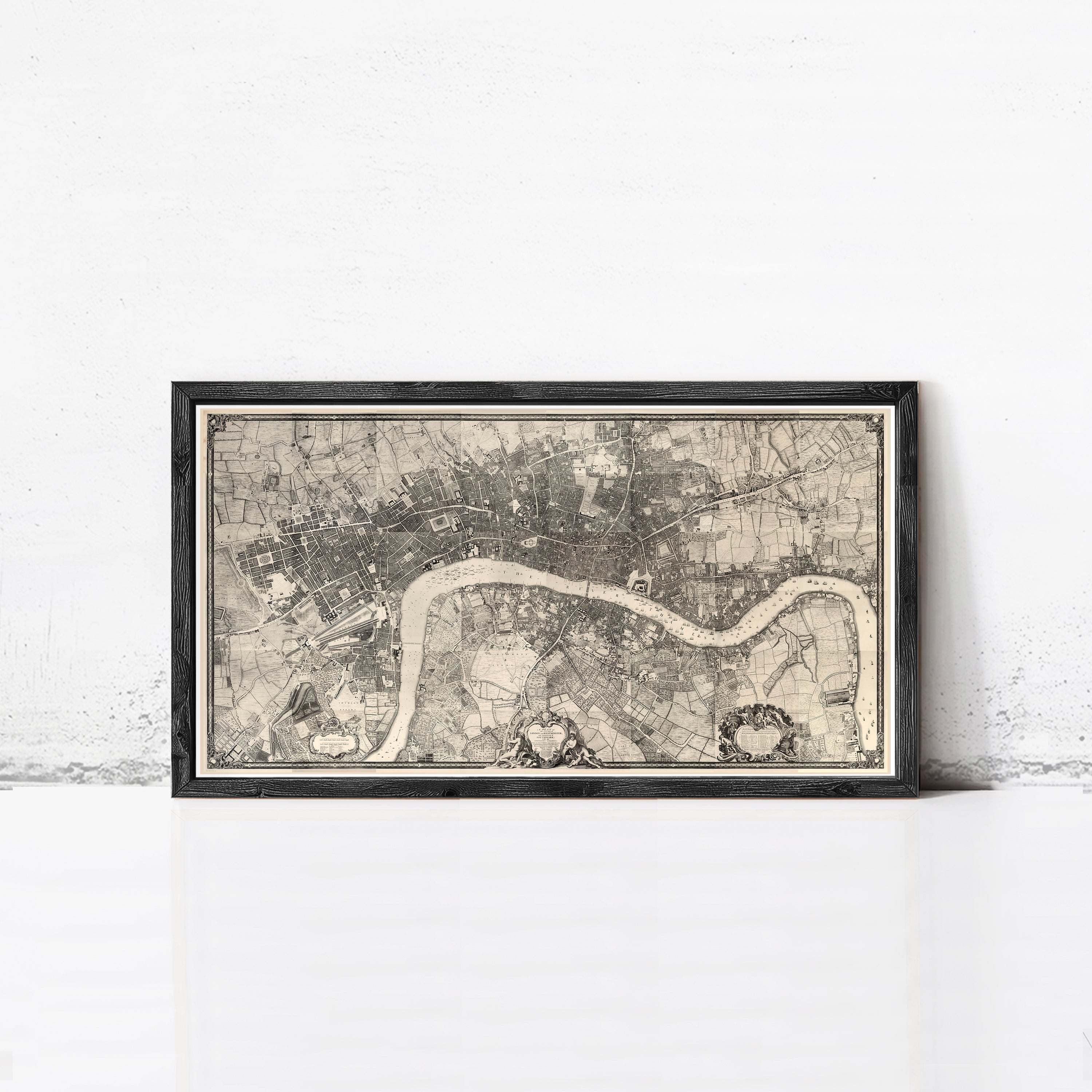 The image is a framed black and white map of London, England, with a detailed and intricate design.