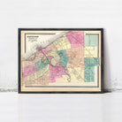 The image is a framed vintage map of Cleveland, Ohio, depicting the city's streets and neighborhoods in a colorful, detailed manner.
