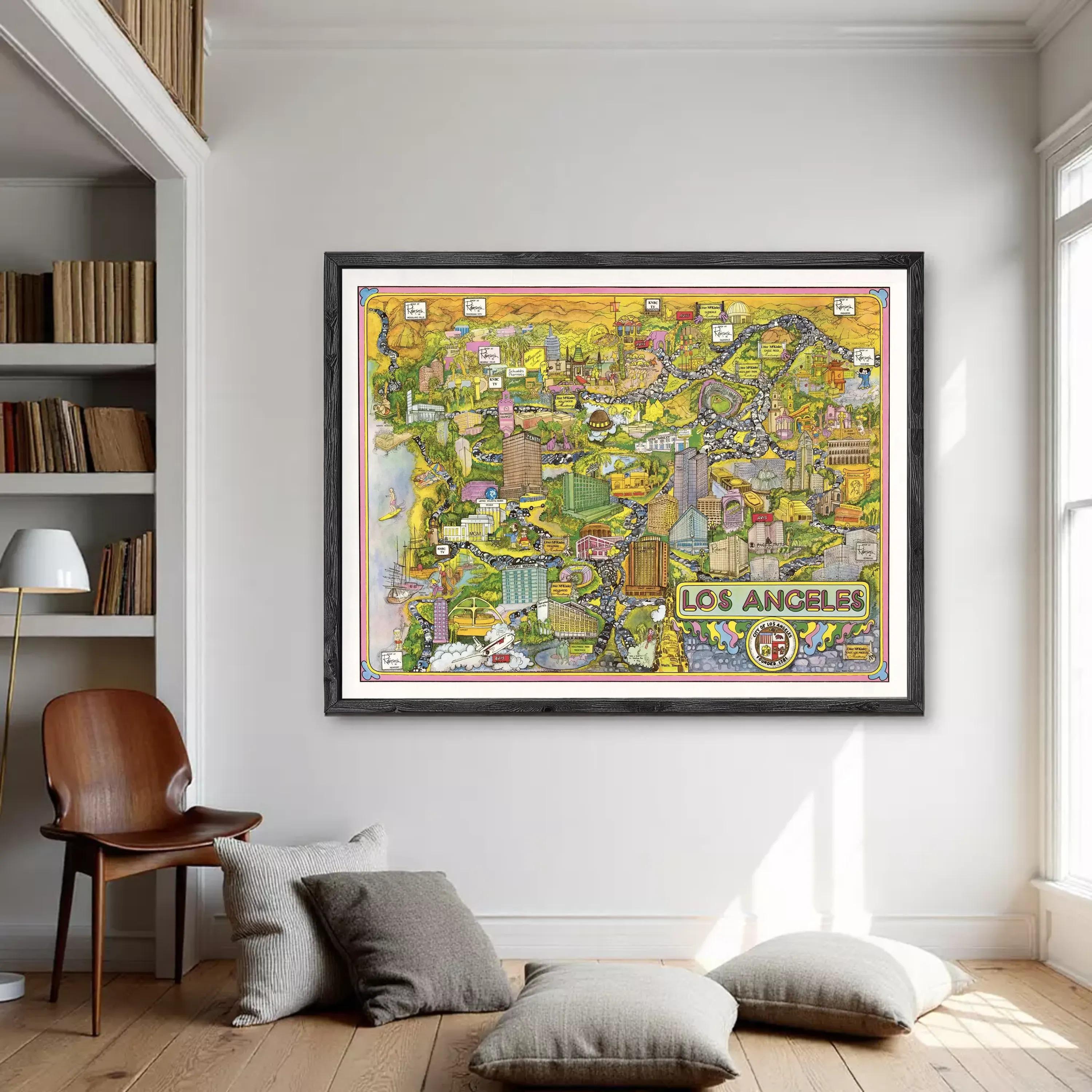 a large framed map of Los Angeles hanging on a wall in a room with a wooden floor and a bookshelf.